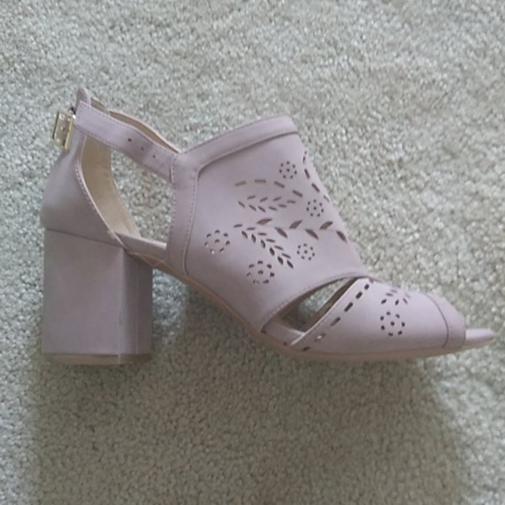 Women's size 8.5 tan colored heels.